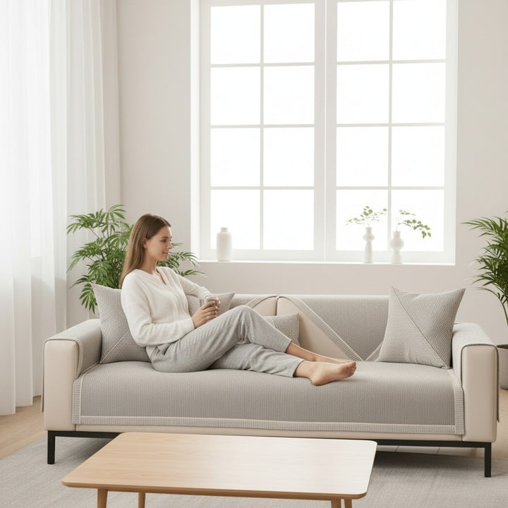 Quilted cotton-linen sofa cover with a non-slip backing on a couch - product photo 2