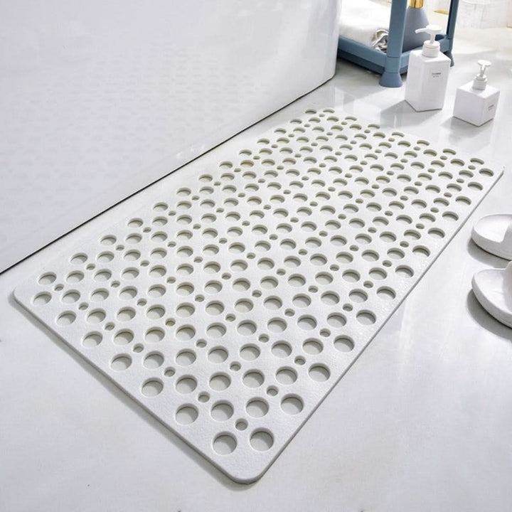 Non-slip shower mat with suction cups and drainage holes in a bathtub - product photo 11