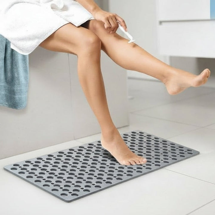 Non-slip shower mat with suction cups and drainage holes in a bathtub - product photo 3