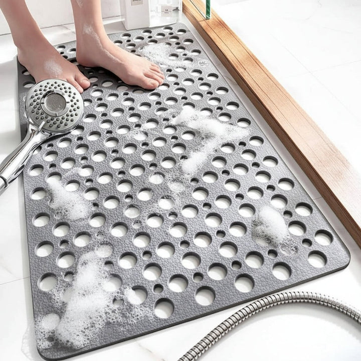 Non-slip shower mat with suction cups and drainage holes in a bathtub - product photo 4
