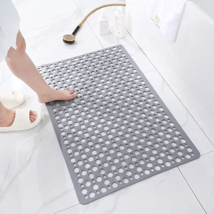 Non-slip shower mat with suction cups and drainage holes in a bathtub - product photo 6