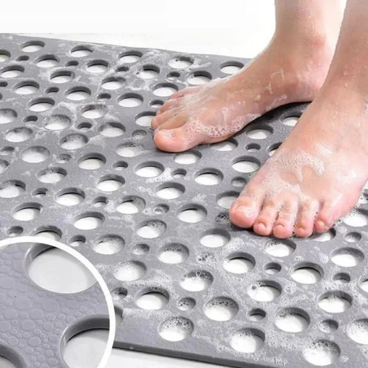 Non-slip shower mat with suction cups and drainage holes in a bathtub - product photo 8