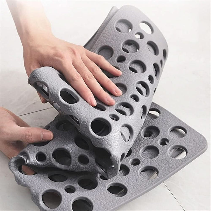 Non-slip shower mat with suction cups and drainage holes in a bathtub - product photo 9