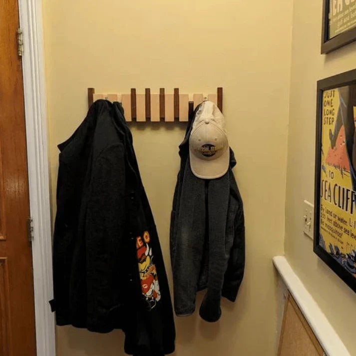 Piano-shaped wooden coat rack mounted on a wall - product photo 1