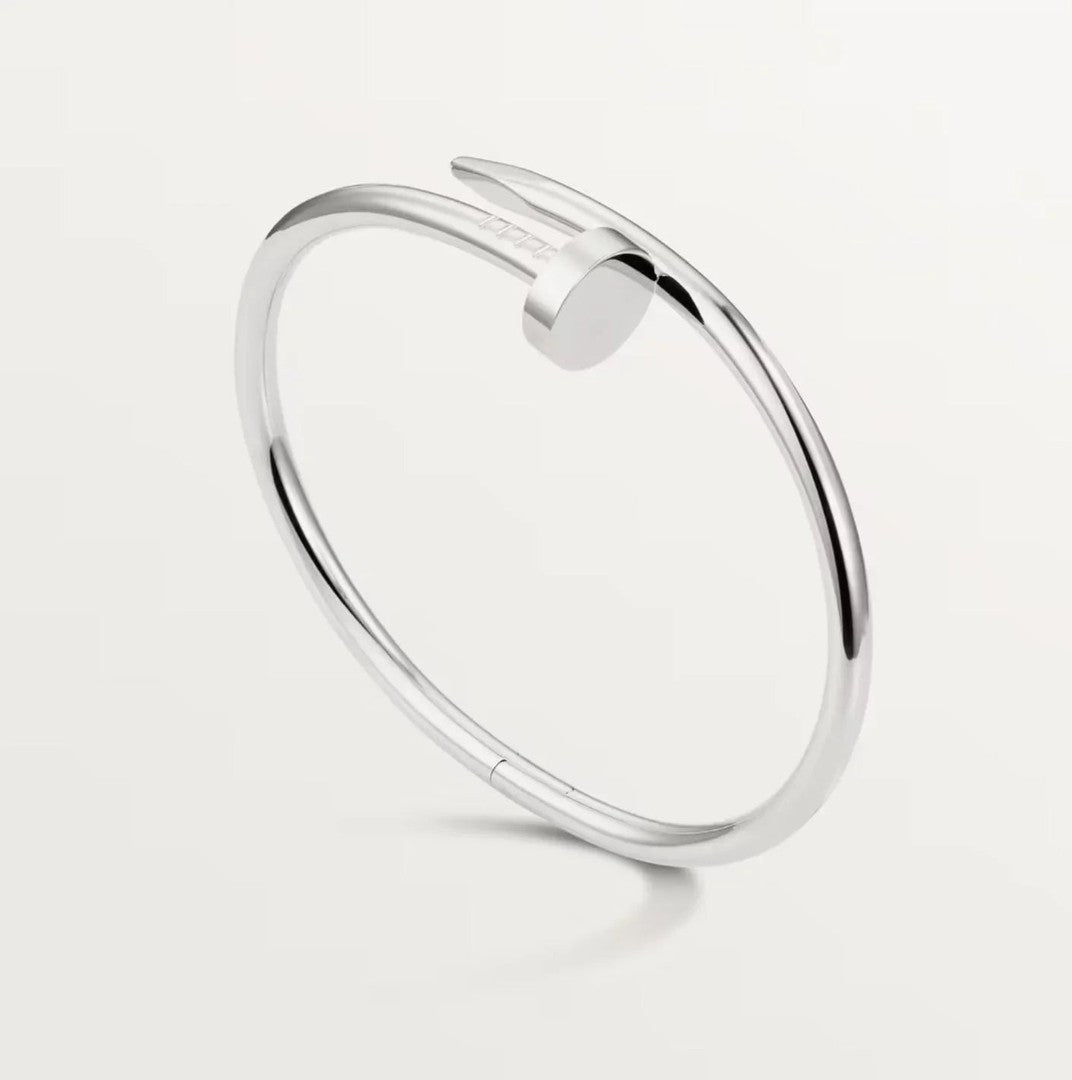 Polished silver nail-form cuff bracelet - product photo 1