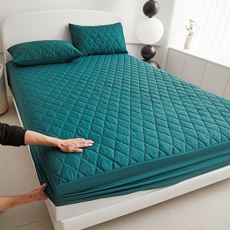 Quilted waterproof mattress protector on a bed - product photo 1