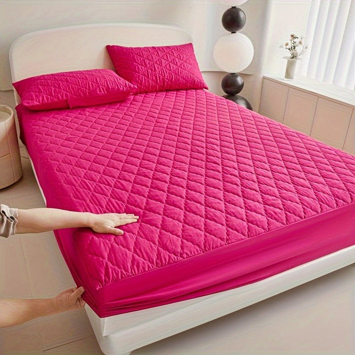 Quilted waterproof mattress protector on a bed - product photo 10