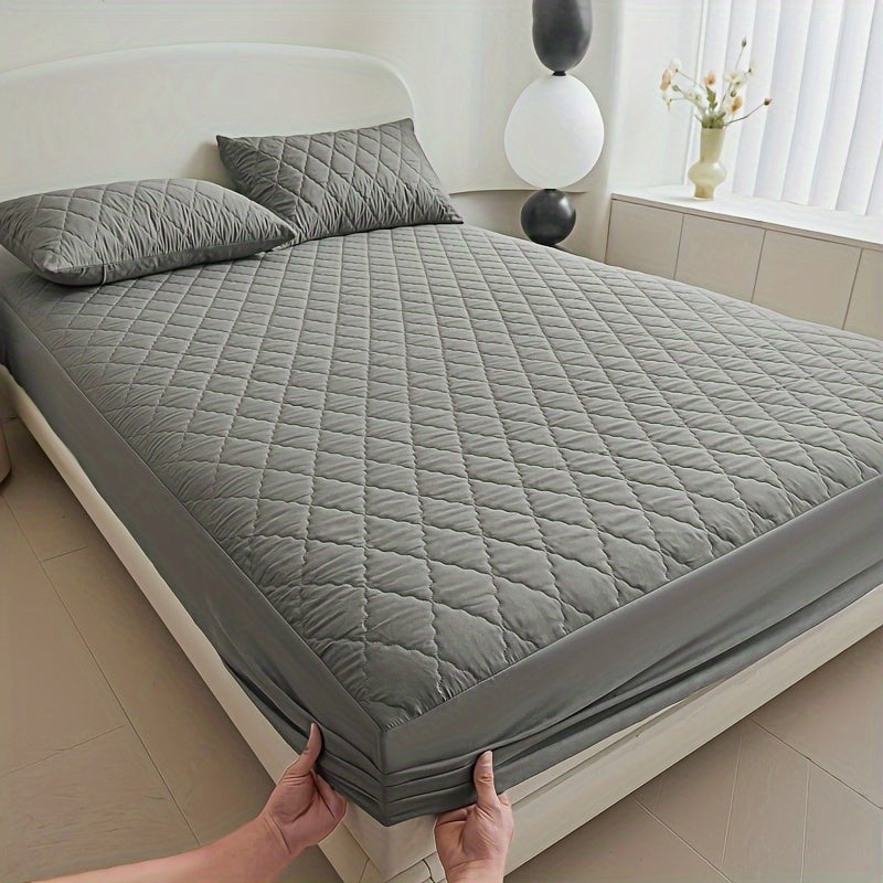 Quilted waterproof mattress protector on a bed - product photo 11
