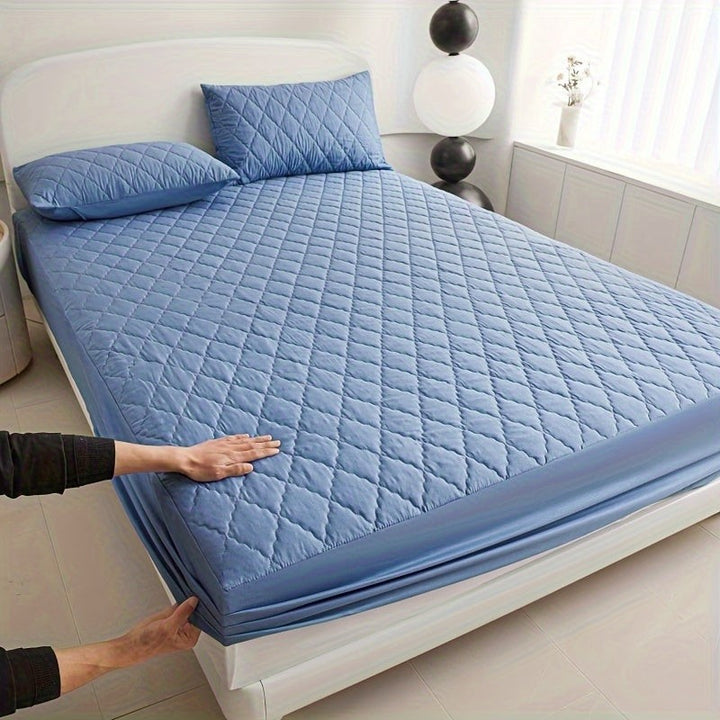 Quilted waterproof mattress protector on a bed - product photo 12