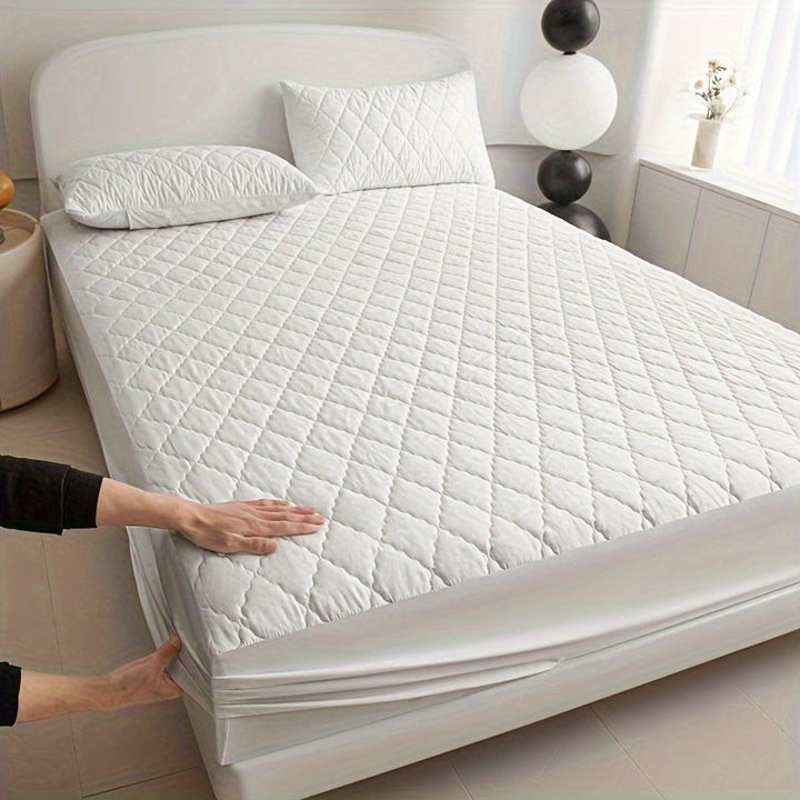 Quilted waterproof mattress protector on a bed - product photo 14
