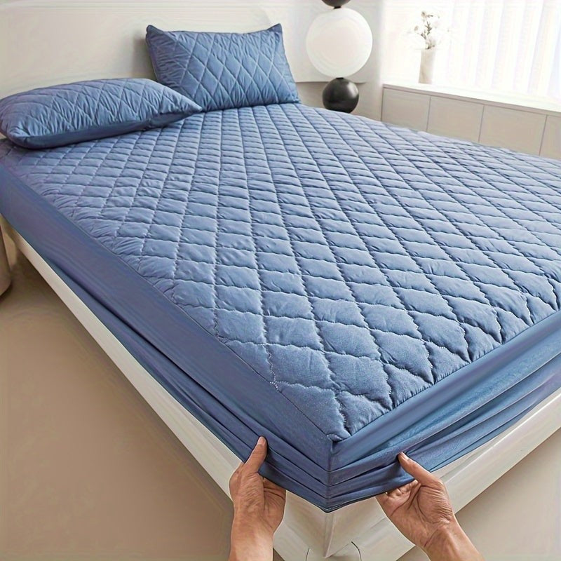 Quilted waterproof mattress protector on a bed - product photo 15