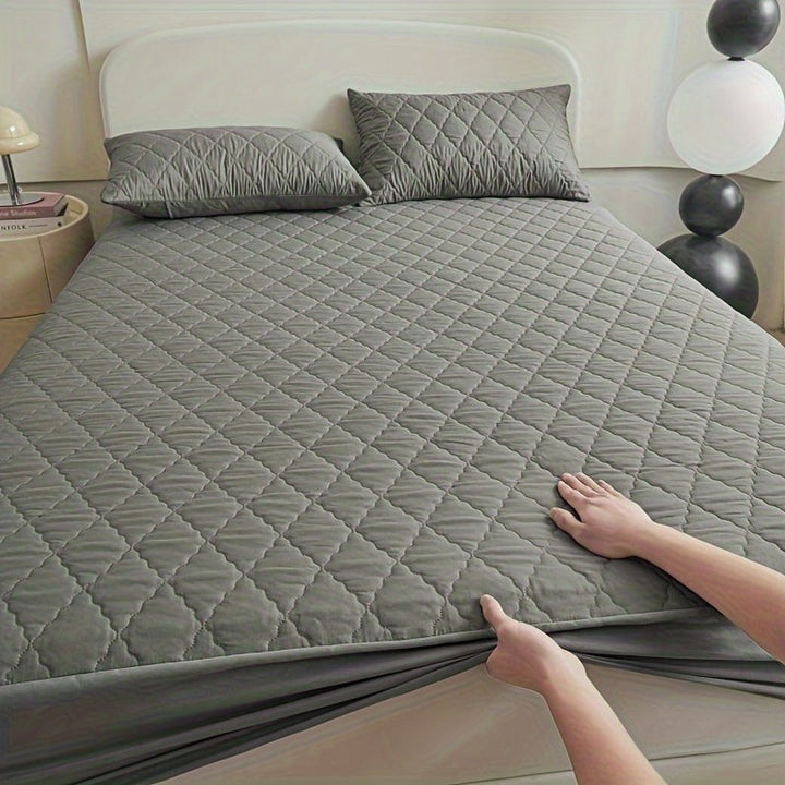Quilted waterproof mattress protector on a bed - product photo 16