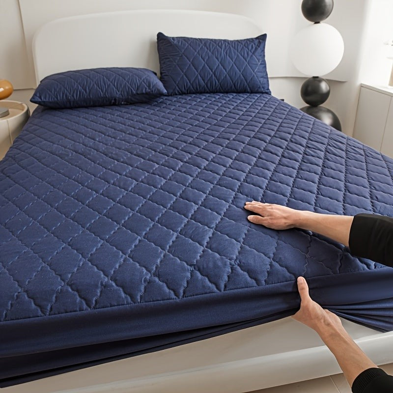 Quilted waterproof mattress protector on a bed - product photo 17