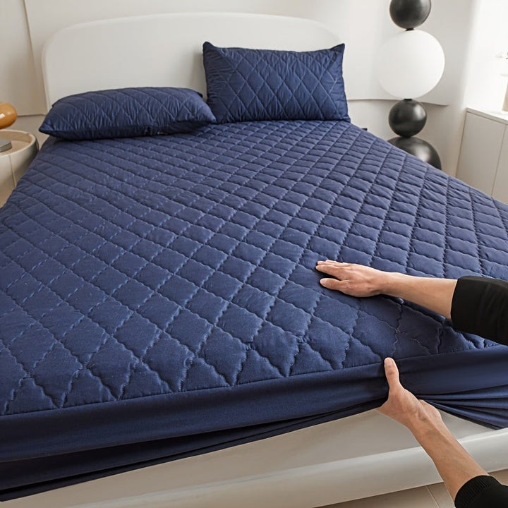 Quilted waterproof mattress protector on a bed - product photo 17