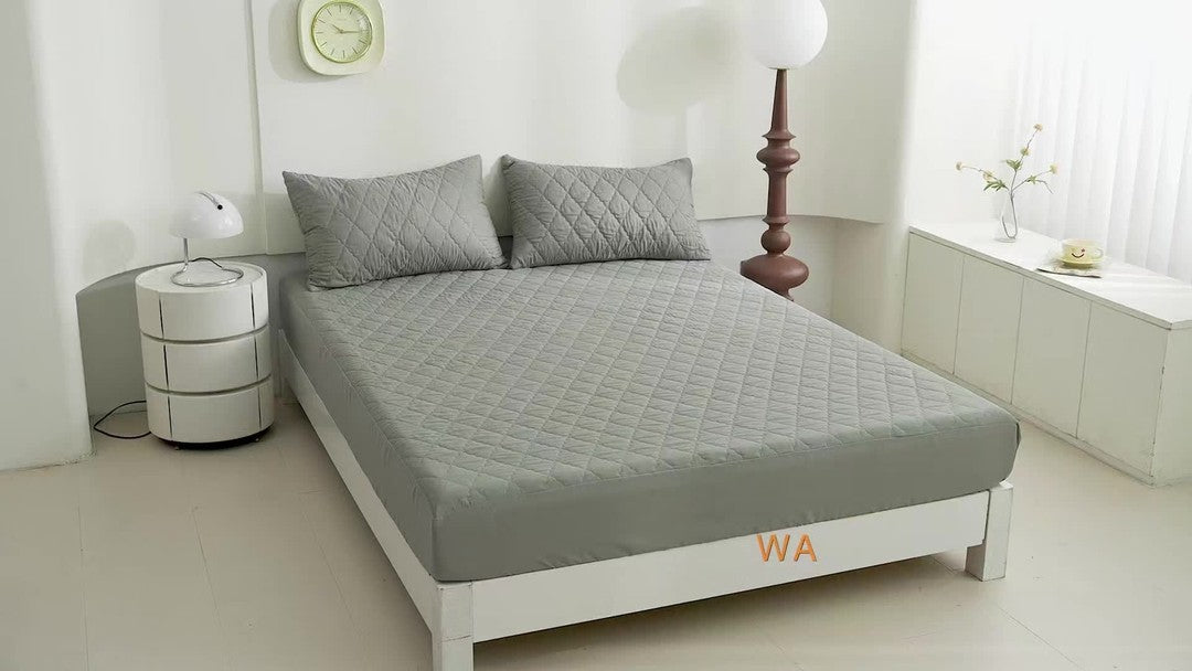 Quilted waterproof mattress protector on a bed - product photo 18