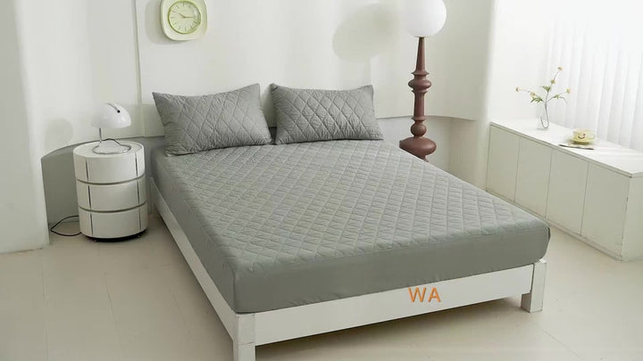 Quilted waterproof mattress protector on a bed - product photo 18