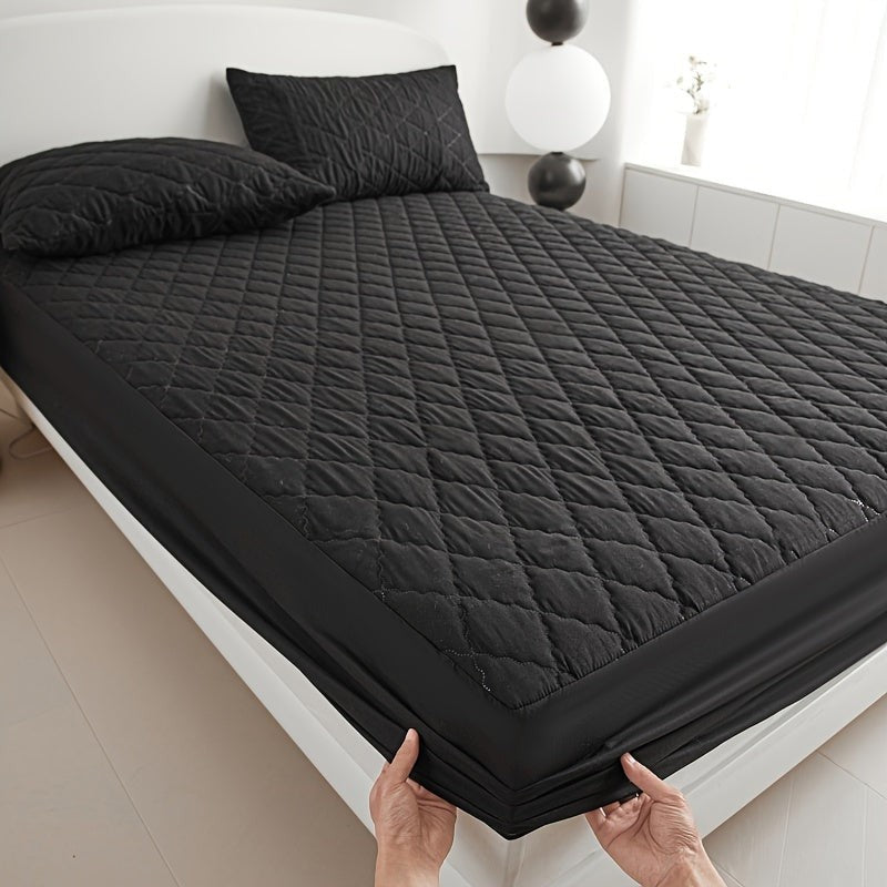 Quilted waterproof mattress protector on a bed - product photo 3