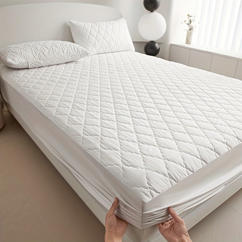 Quilted waterproof mattress protector on a bed - product photo 5