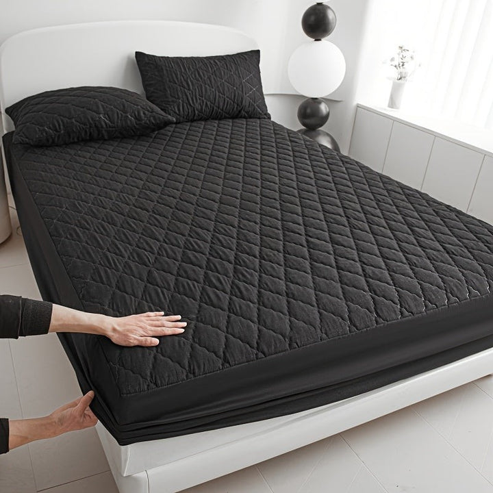 Quilted waterproof mattress protector on a bed - product photo 6