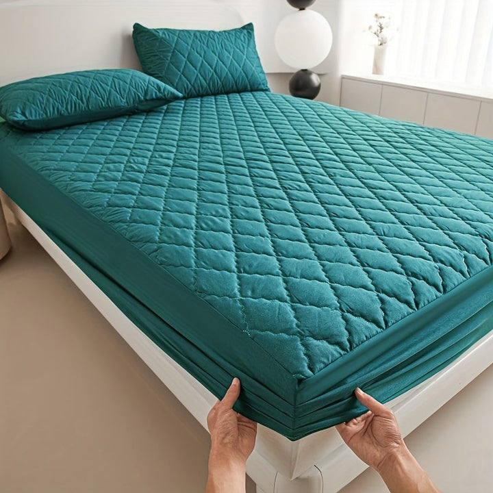 Quilted waterproof mattress protector on a bed - product photo 7