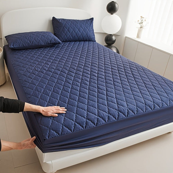 Quilted waterproof mattress protector on a bed - product photo 8