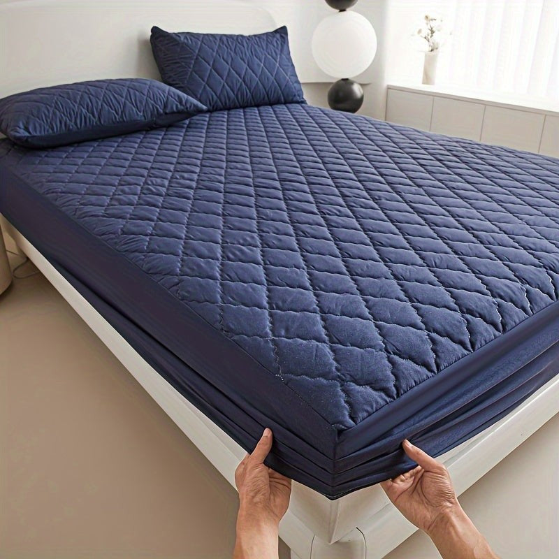 Quilted waterproof mattress protector on a bed - product photo 9