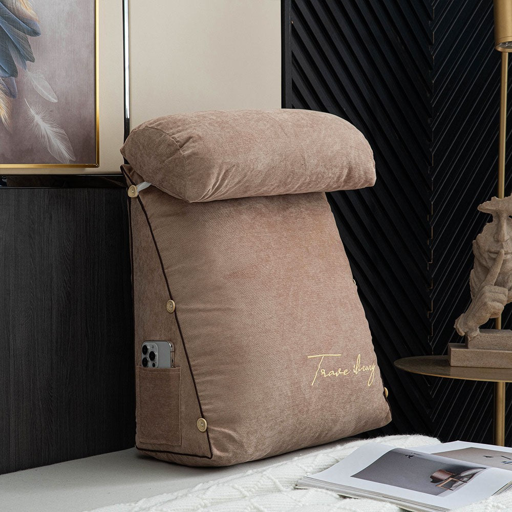Reading cushion with arms and a side pocket on a bed - product photo 3