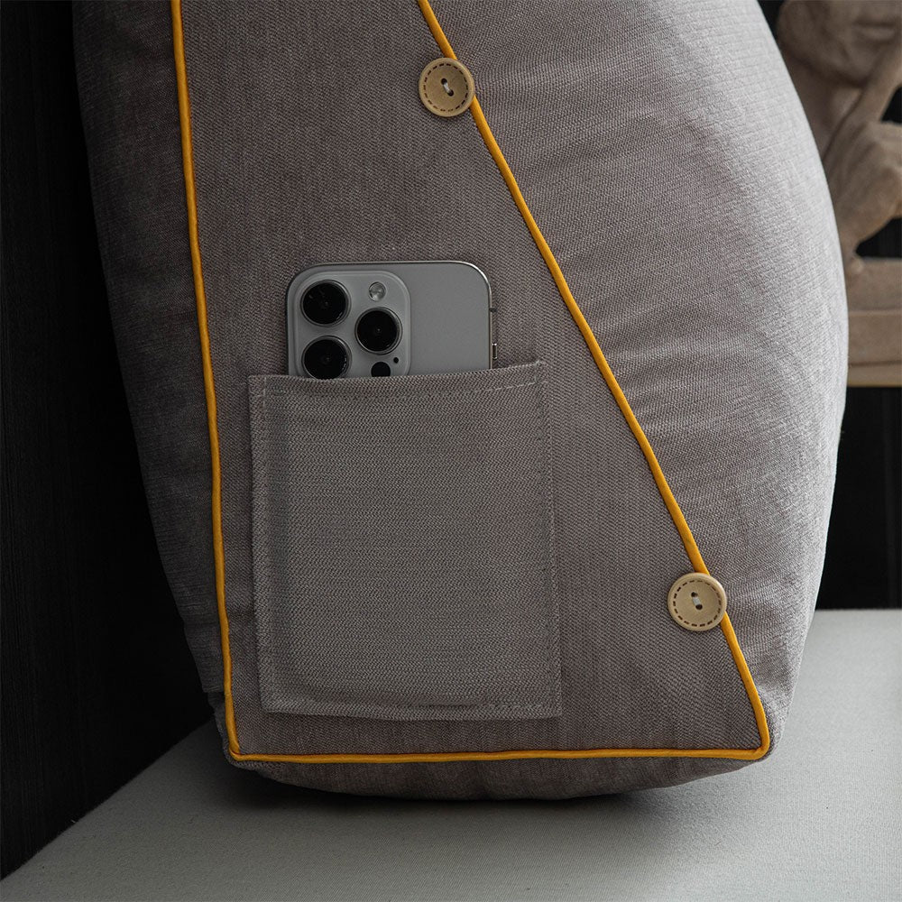 Reading cushion with arms and a side pocket on a bed - product photo 9