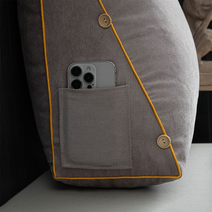 Reading cushion with arms and a side pocket on a bed - product photo 9