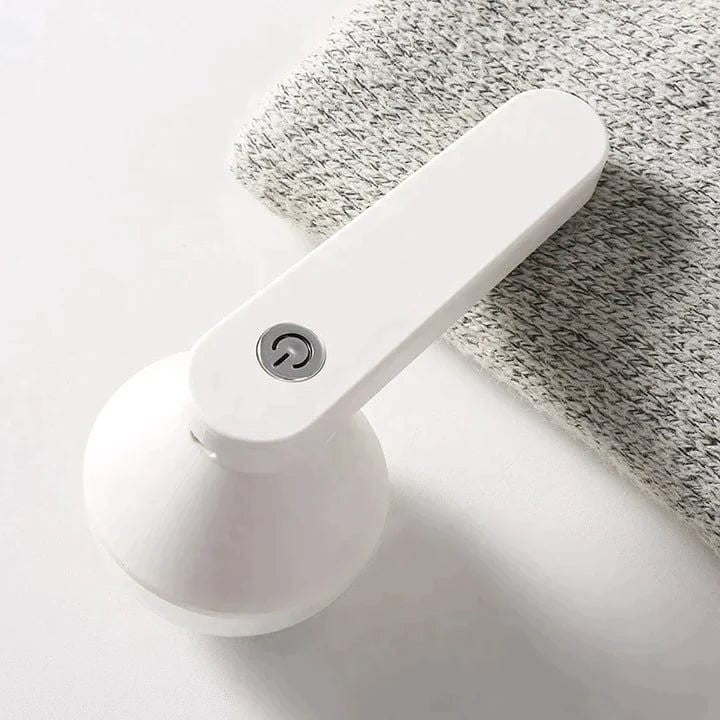 Rechargeable fabric shaver removing pills from a sweater - product photo 2