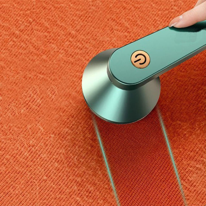 Rechargeable fabric shaver removing pills from a sweater - product photo 4