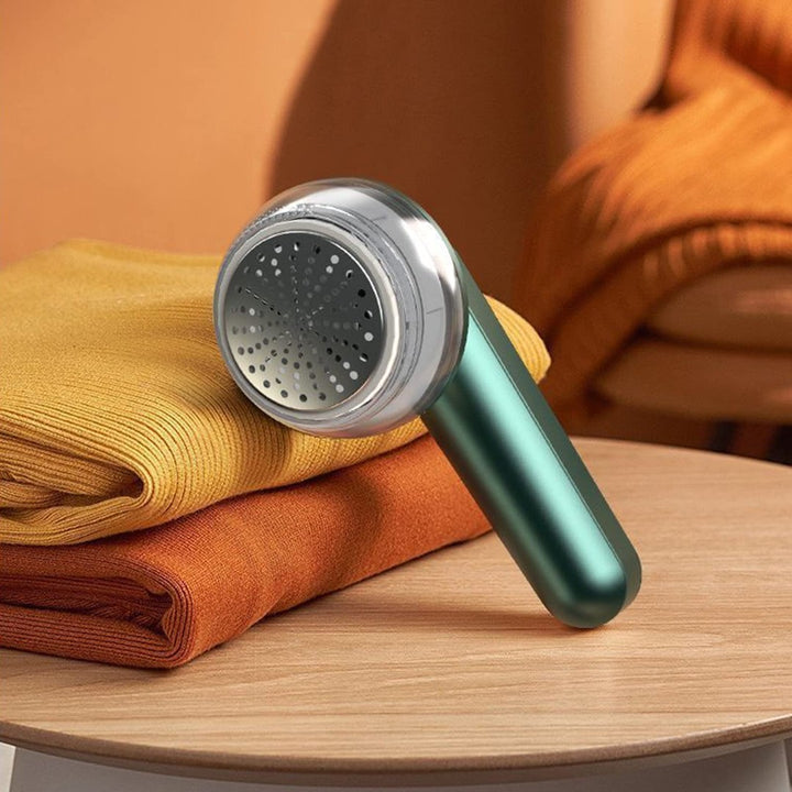 Rechargeable fabric shaver removing pills from a sweater - product photo 5
