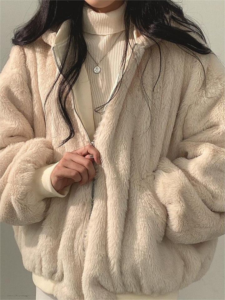 Reversible oversized hooded fleece jacket shown from both sides - product photo 11