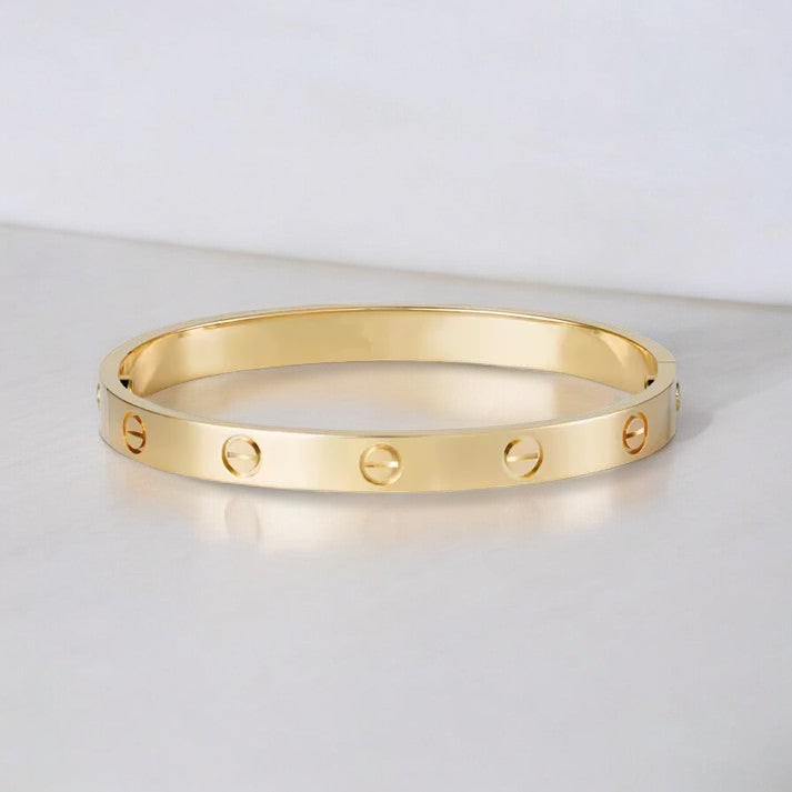 Screw-detail bangle bracelet in a gold tone - product photo 1