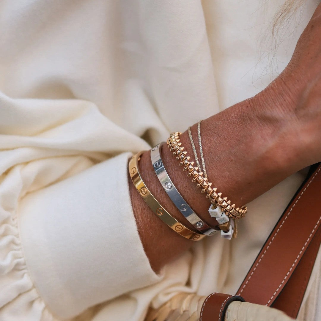 Screw-detail bangle bracelet in a gold tone - product photo 2
