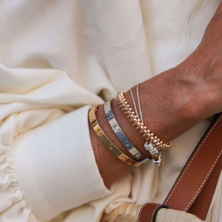 Screw-detail bangle bracelet in a gold tone - product photo 2