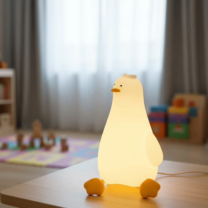 Soft silicone animal night light glowing warm in a nursery - product photo 1