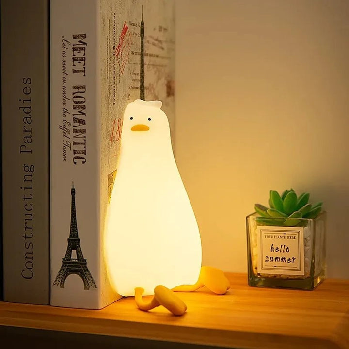 Soft silicone animal night light glowing warm in a nursery - product photo 2