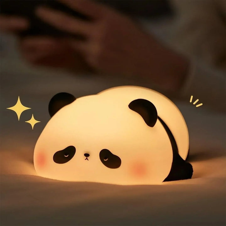 Soft silicone animal night light glowing warm in a nursery - product photo 4