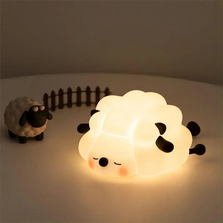 Soft silicone animal night light glowing warm in a nursery - product photo 5