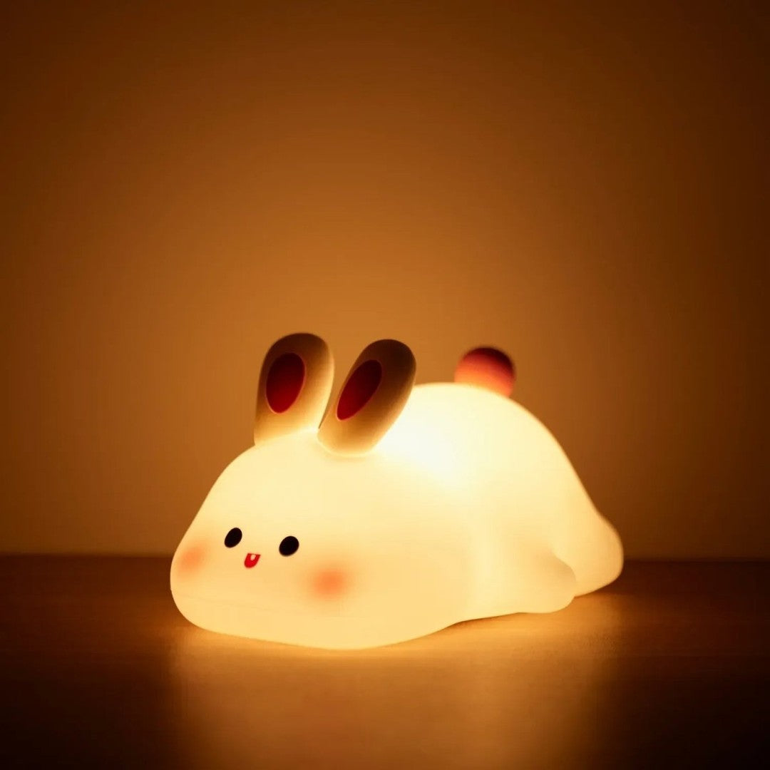 Soft silicone animal night light glowing warm in a nursery - product photo 6