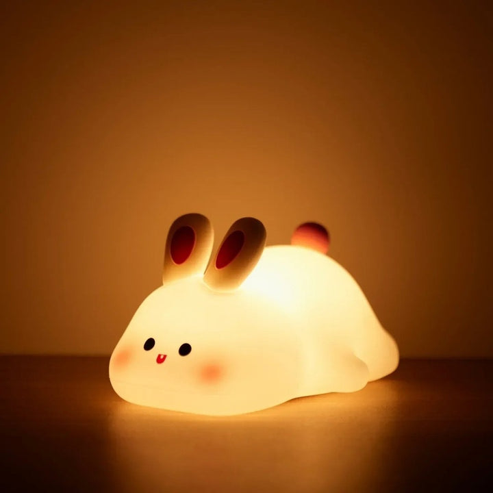 Soft silicone animal night light glowing warm in a nursery - product photo 6