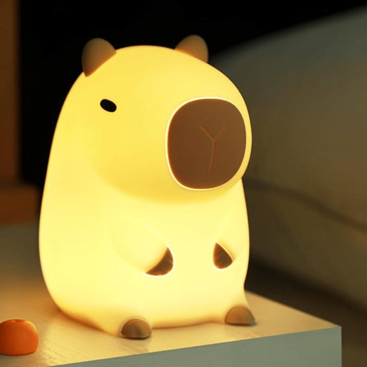 Soft silicone animal night light glowing warm in a nursery - product photo 8