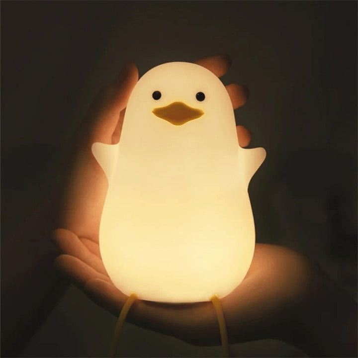 Soft silicone animal night light glowing warm in a nursery - product photo 9