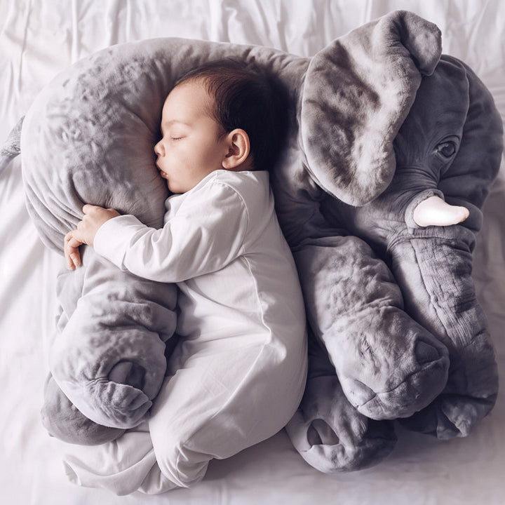 Soft plush elephant cuddle pillow in a child's room - product photo 1
