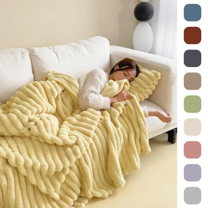 Soft fuzzy throw blanket on a sofa - product photo 2