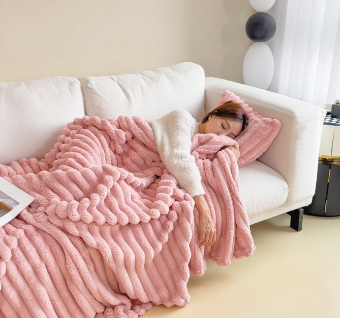 Soft fuzzy throw blanket on a sofa - product photo 3