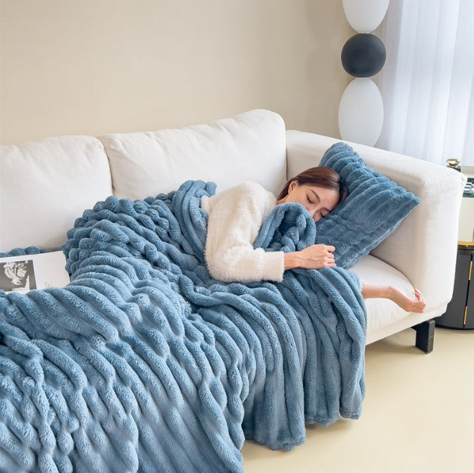 Soft fuzzy throw blanket on a sofa - product photo 4
