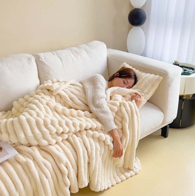 Soft fuzzy throw blanket on a sofa - product photo 5
