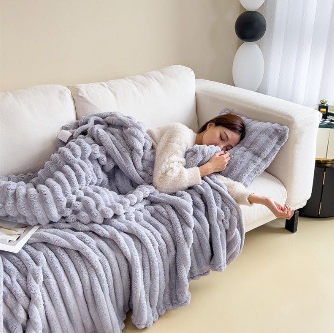 Soft fuzzy throw blanket on a sofa - product photo 6